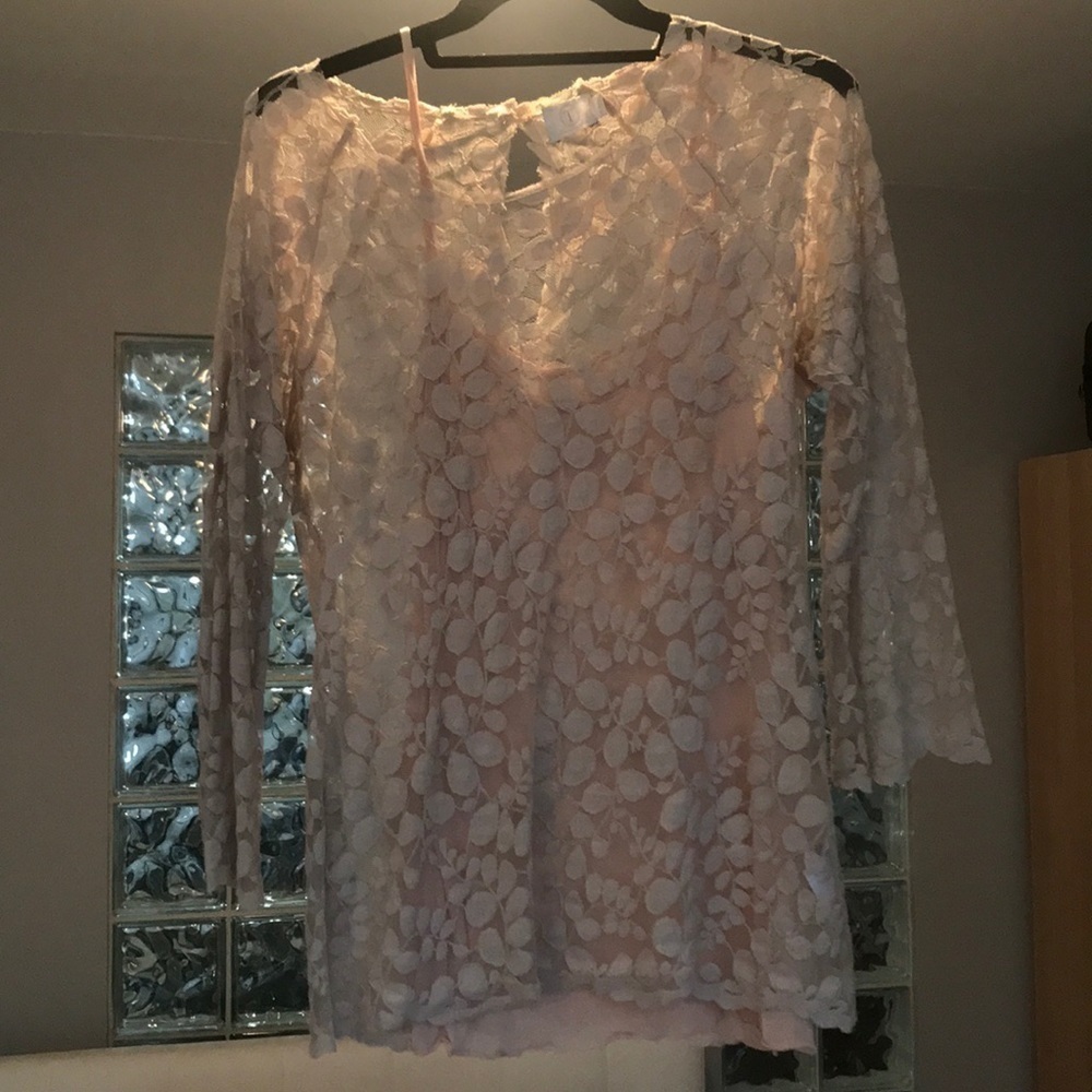 Feminine lace three quarter length sleeve top.​​​​​​​​​​​​​​​​​​​​​​​​